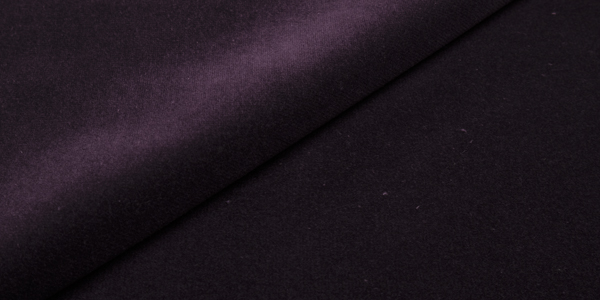 Plum Ritz fabric texture close-up.